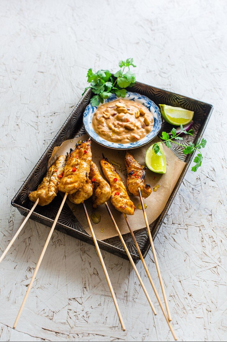 Chicken satay skewers with coriander and a peanut dip