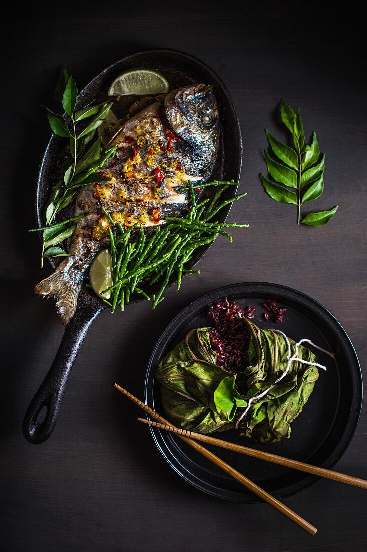 Oriental style grilled seabass with red rice and queller