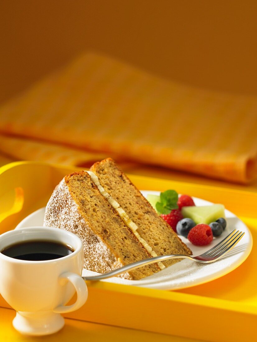 Slice of banana coffee cake with berries