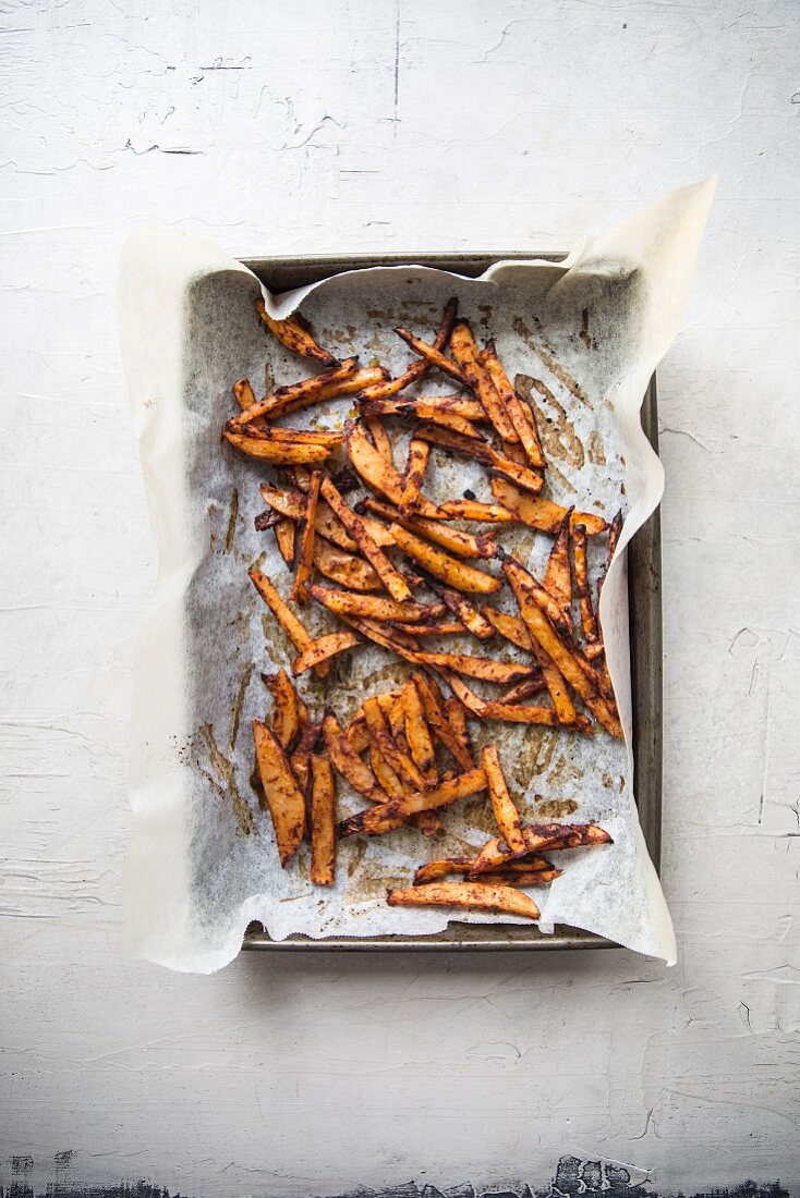 Crispy french fries on a baking sheet