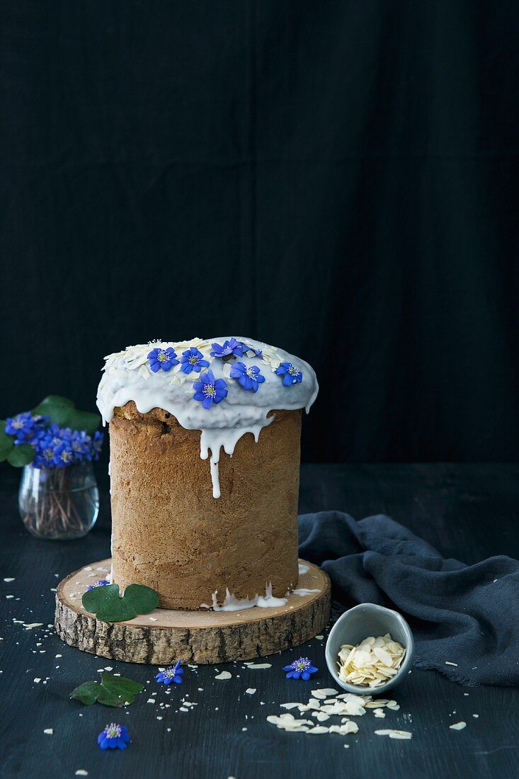 Easter bread topped with icing and almond flakes