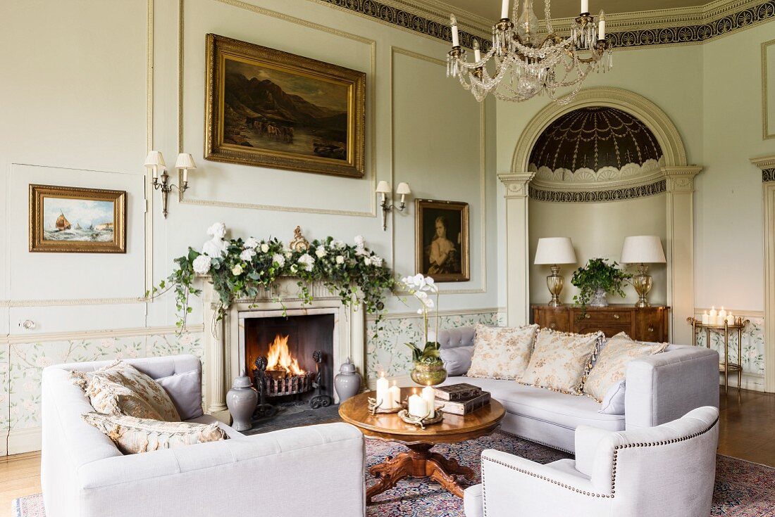 Stately drawing room with Christmas garland of ivy on mantelpiece