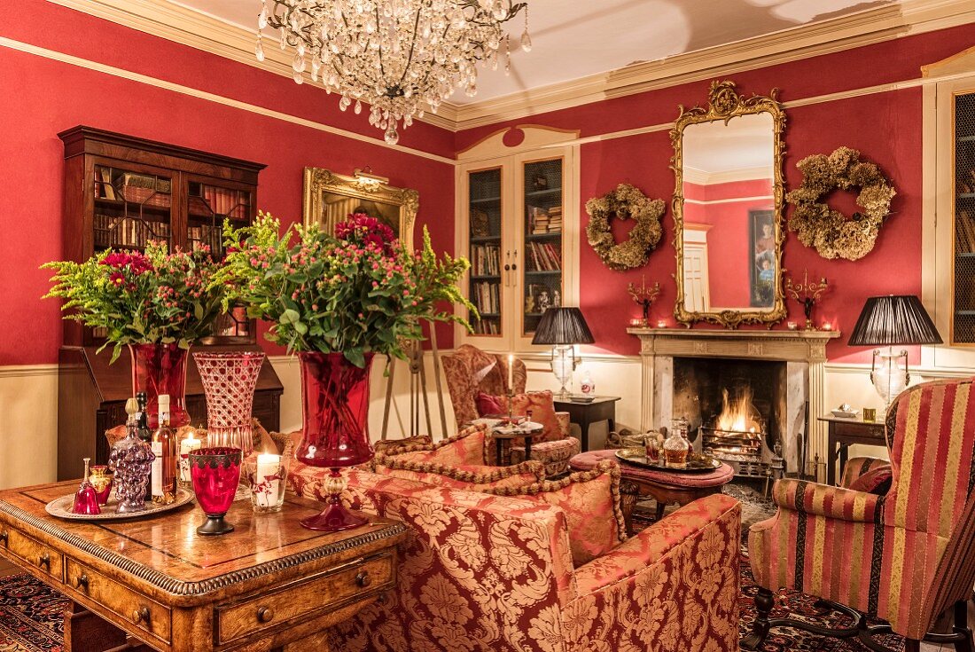 Open fireplace in classic living room in shades of red