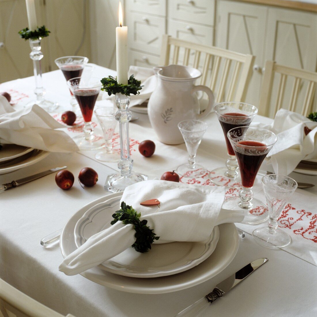 Wreaths of leaves as linen napkins on festively set table