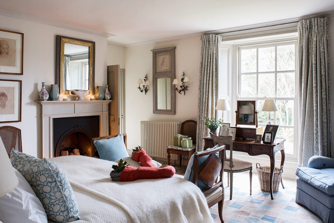 Desk below window in classic bedroom