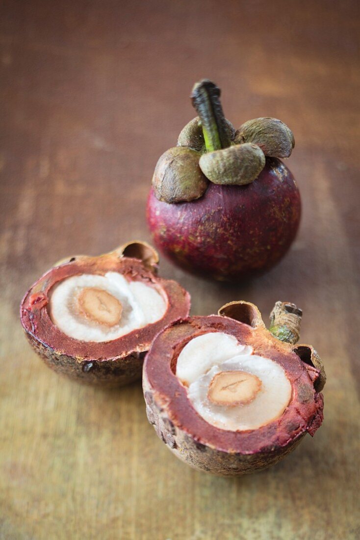 Mangosteens, whole and halved