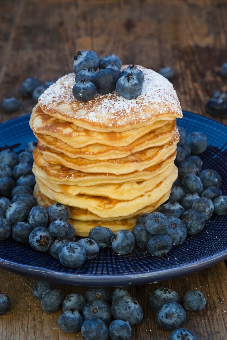 Pancakes with blueberries on plate