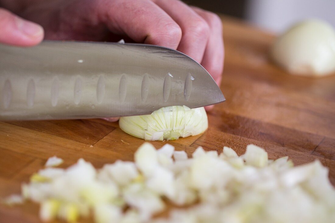 Chopping onions with a Santoku knife