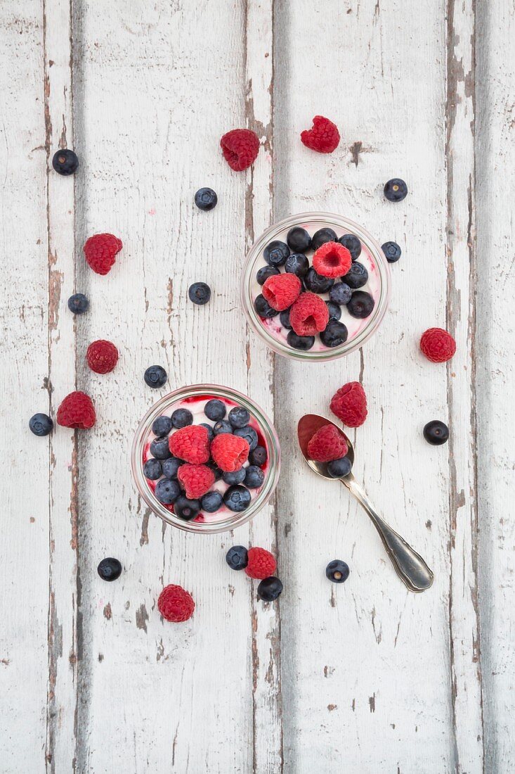 Greek yoghurt with fruit jelly and fresh raspberries and blueberries