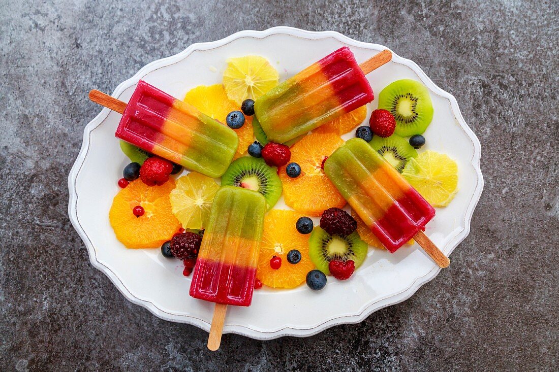 Plate of homemade fruit smoothie ice lollies