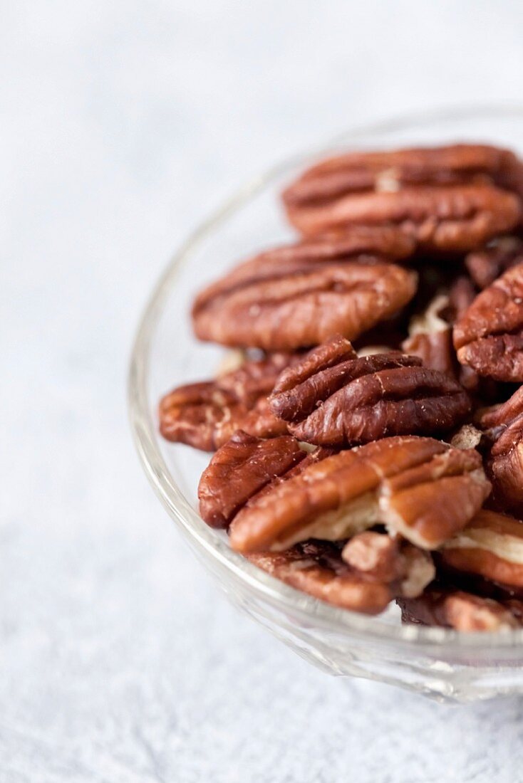 Pecan nuts in a glass bowl