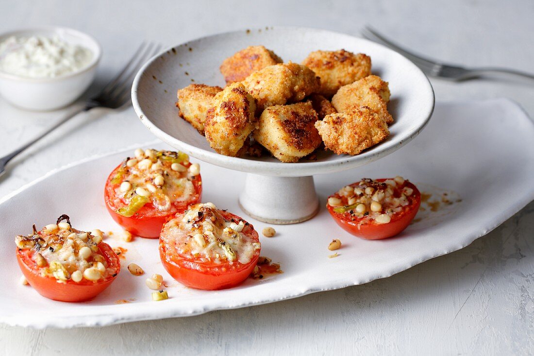 Chicken nuggets with stuffed tomatoes