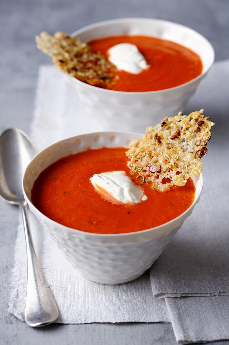 Red pepper and tomato soup with parmesan chips