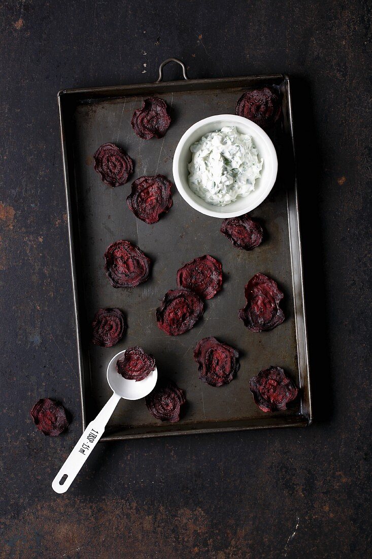 Homemade beetroot chips with herb quark
