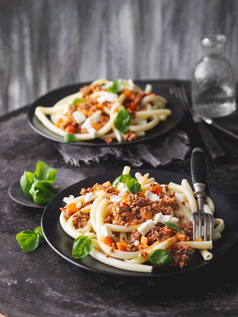 Macaroni with red pepper and minced beef sauce