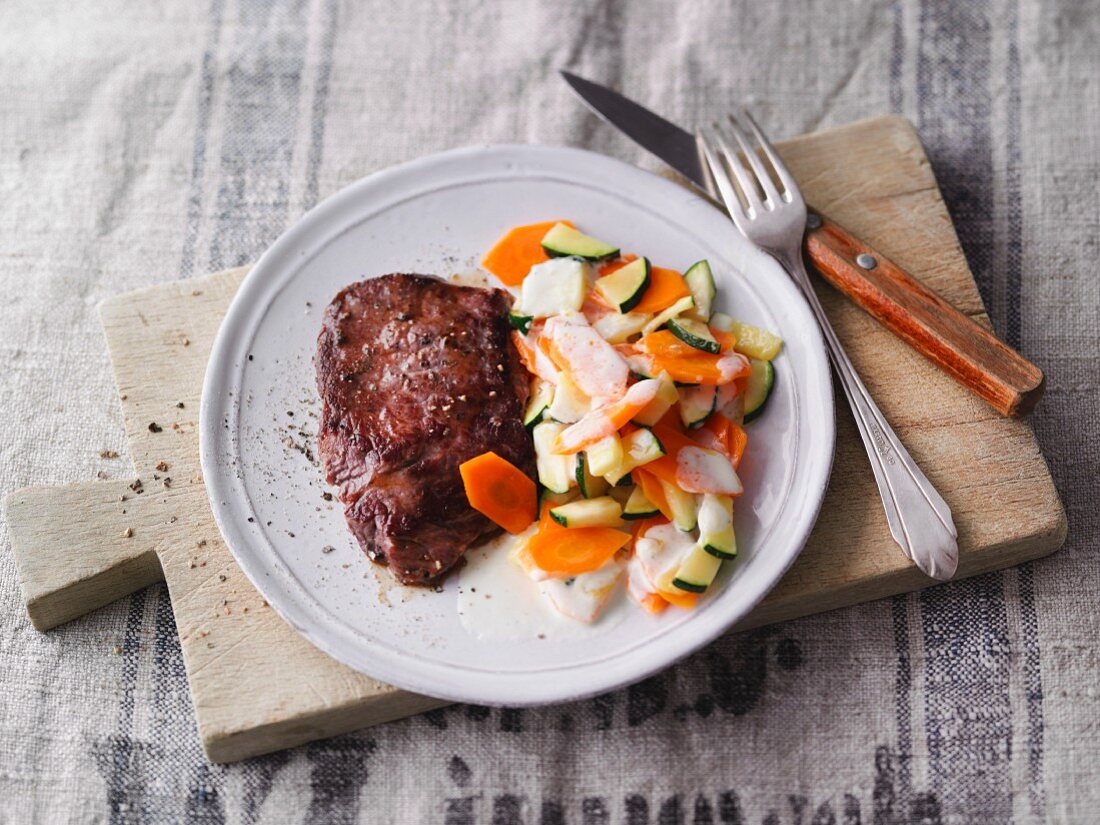 Beef steak with courgette and carrots