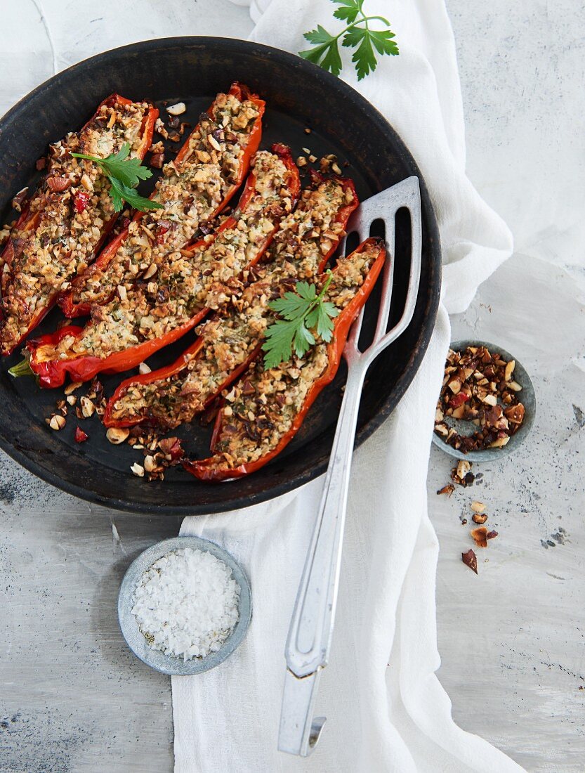 Pointed peppers filled with buckwheat and cream cheese and topped with oven-roasted chilli almonds