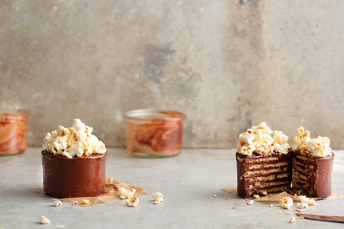 Layered chocolate biscuit cakes topped with popcorn