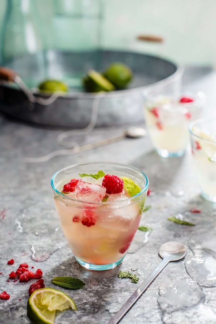 Homemade lemonade with raspberries in glasses