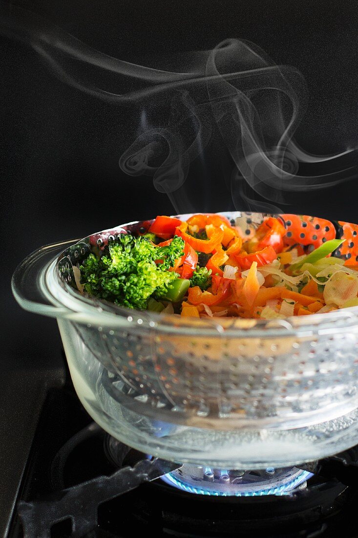 Steamed vegetables in a steamer