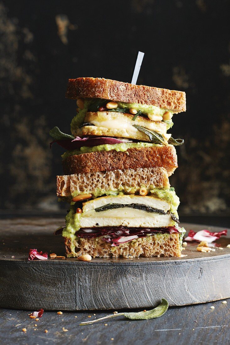 A spelt bread sandwich with courgette cream, crispy tofu and sage