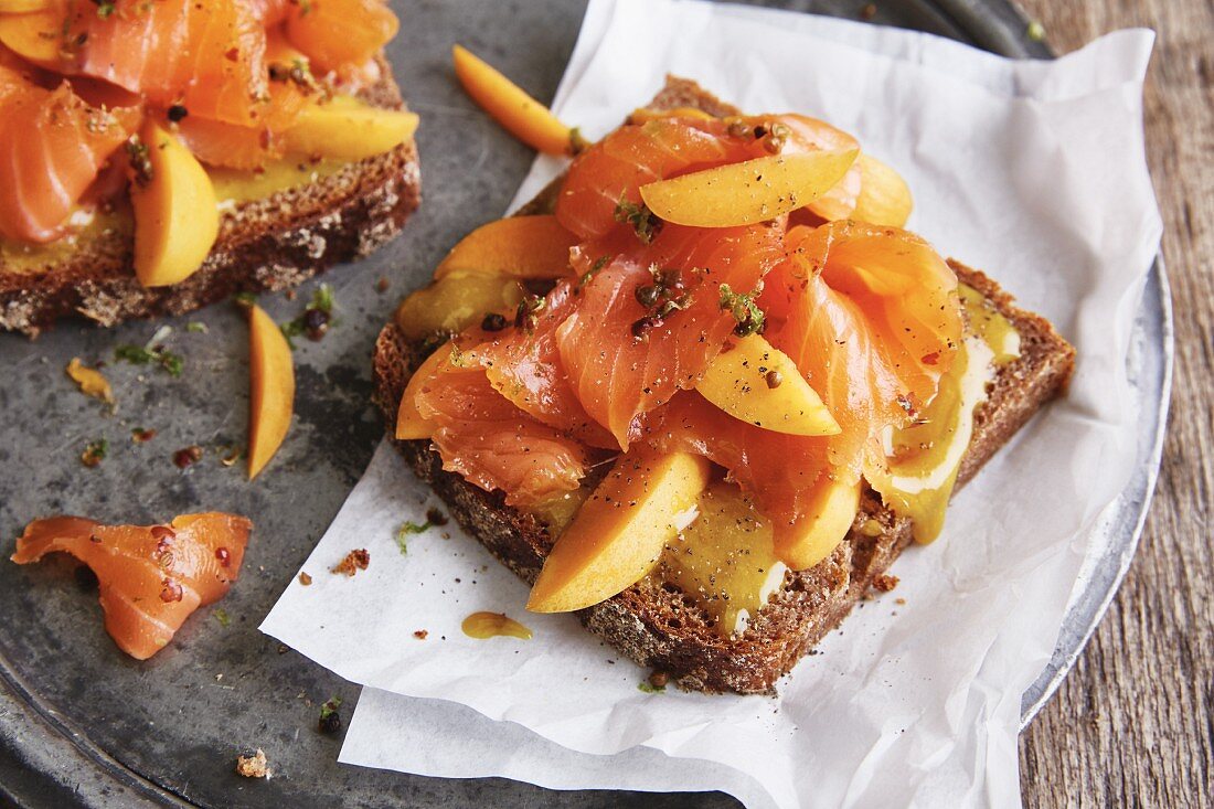 Wholemeal bread with pickled salmon, fresh apricots and honey mustard
