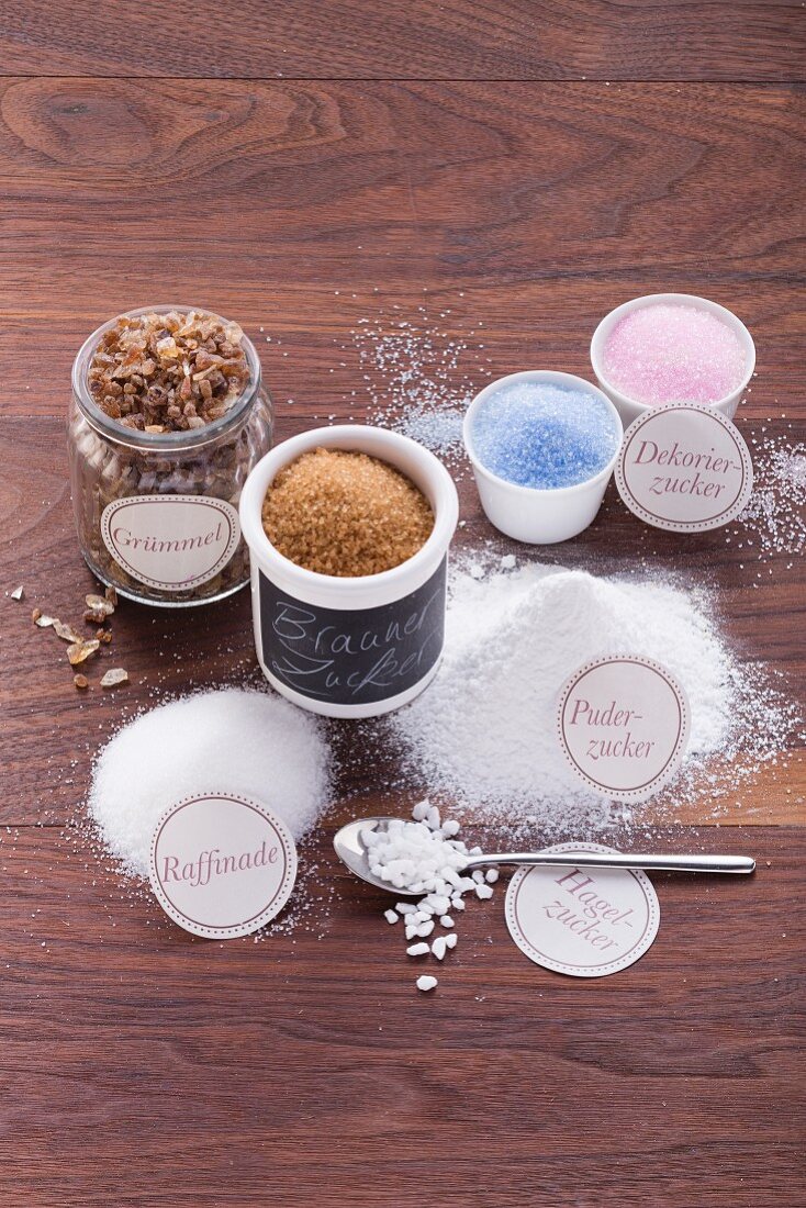 Various types of sugar for baking (refined sugar, sugar nibs, icing sugar, vanilla sugar, rock sugar, brown sugar, and decorative sugar)