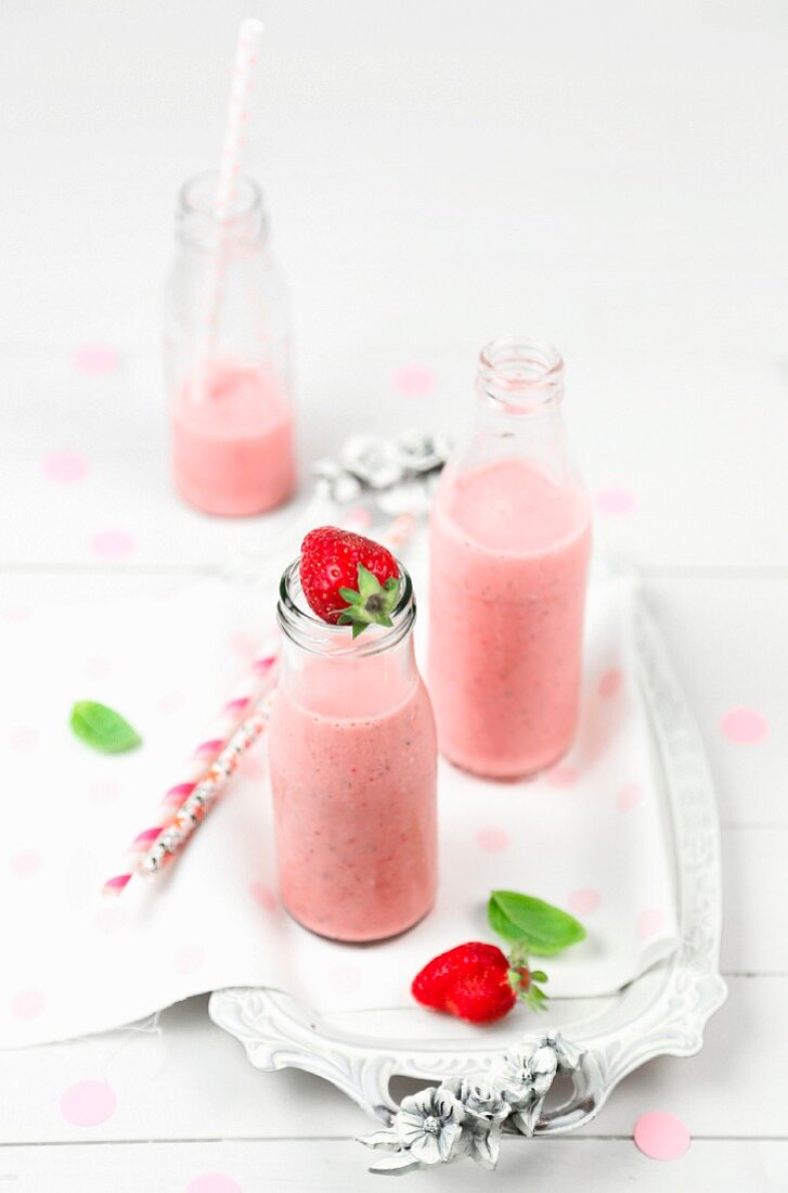 Strawberry smoothie in bottles