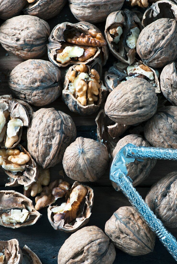 Whole organic walnuts and a nutcracker