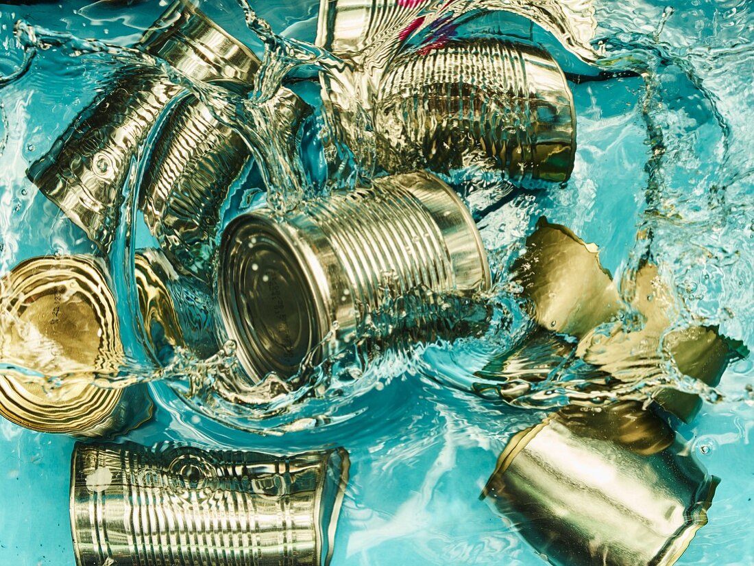 Tin cans falling into water