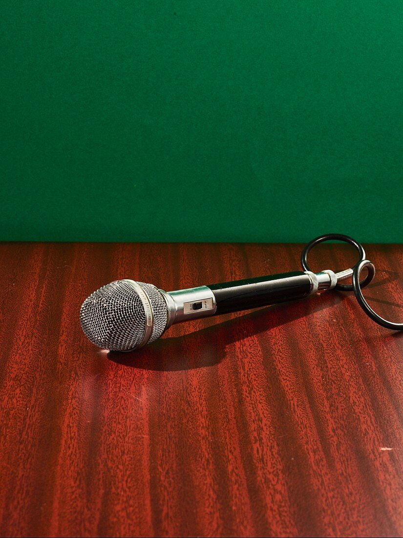 A microphone on a wooden table