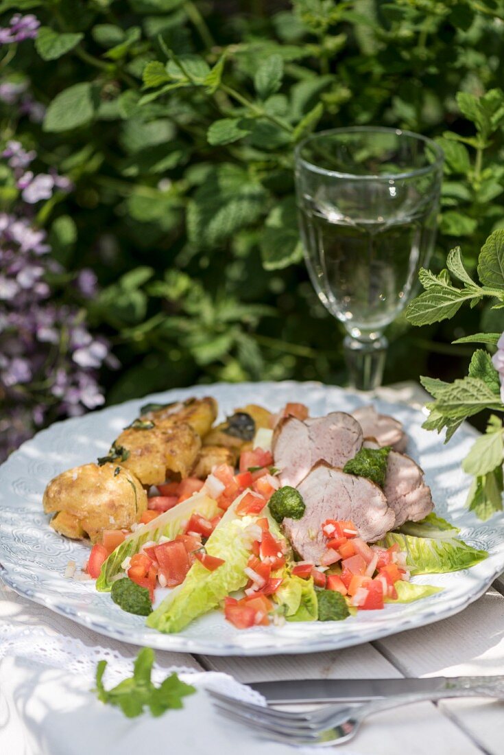 Pork loin with chimichurri, potatoes and criolla salad