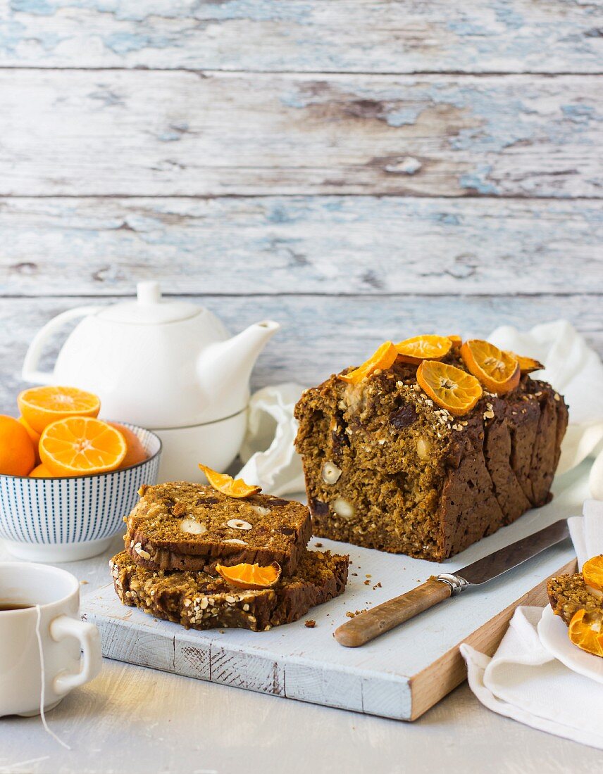 A pumpkin and date loaf with clementines