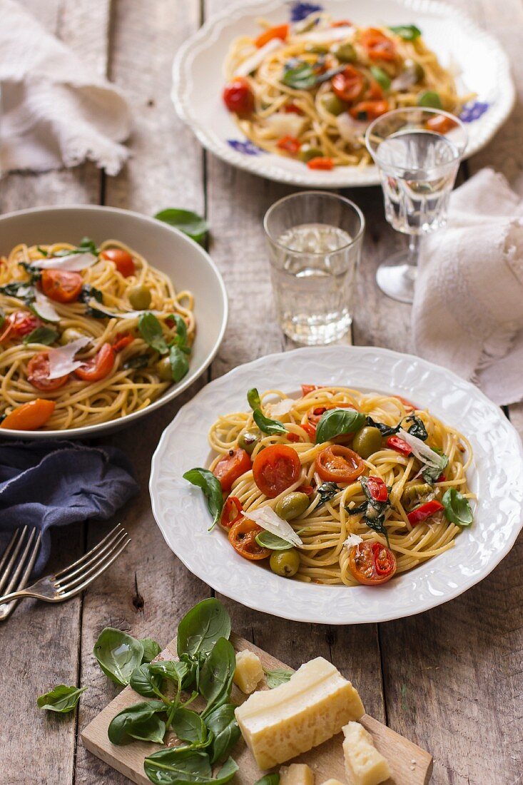 Spaghetti with cherry tomatoes, fresh basil, olives, chilli and parmesan