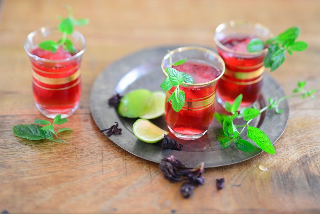 Icy cold hibiscus and mint tea with lime juice