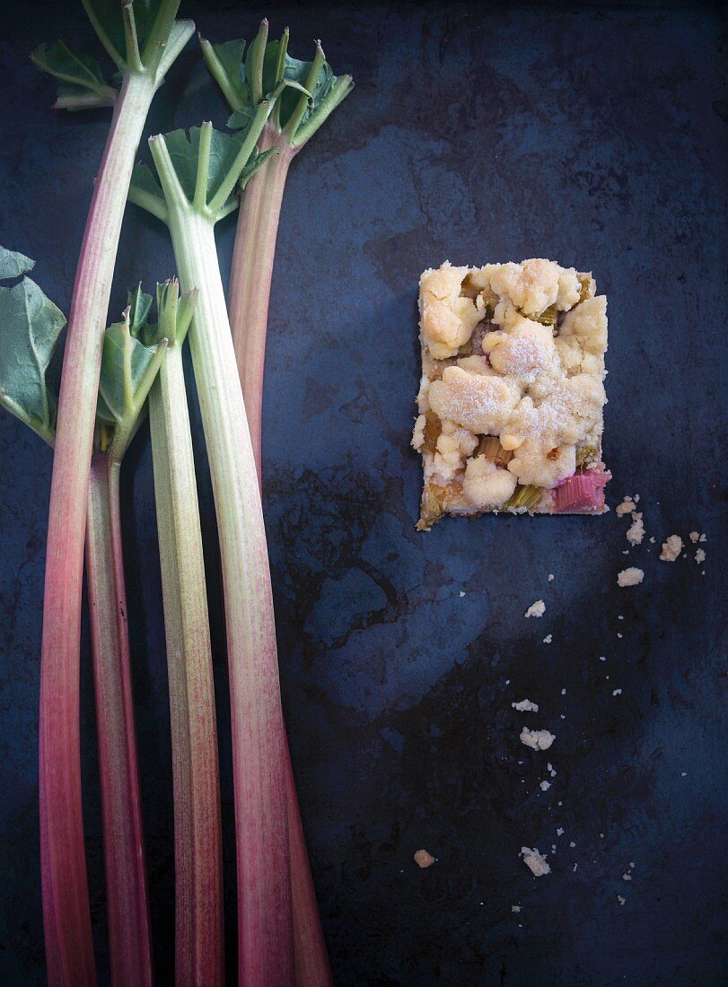 Vegan rhubarb crumb cake with fresh rhubarb sticks