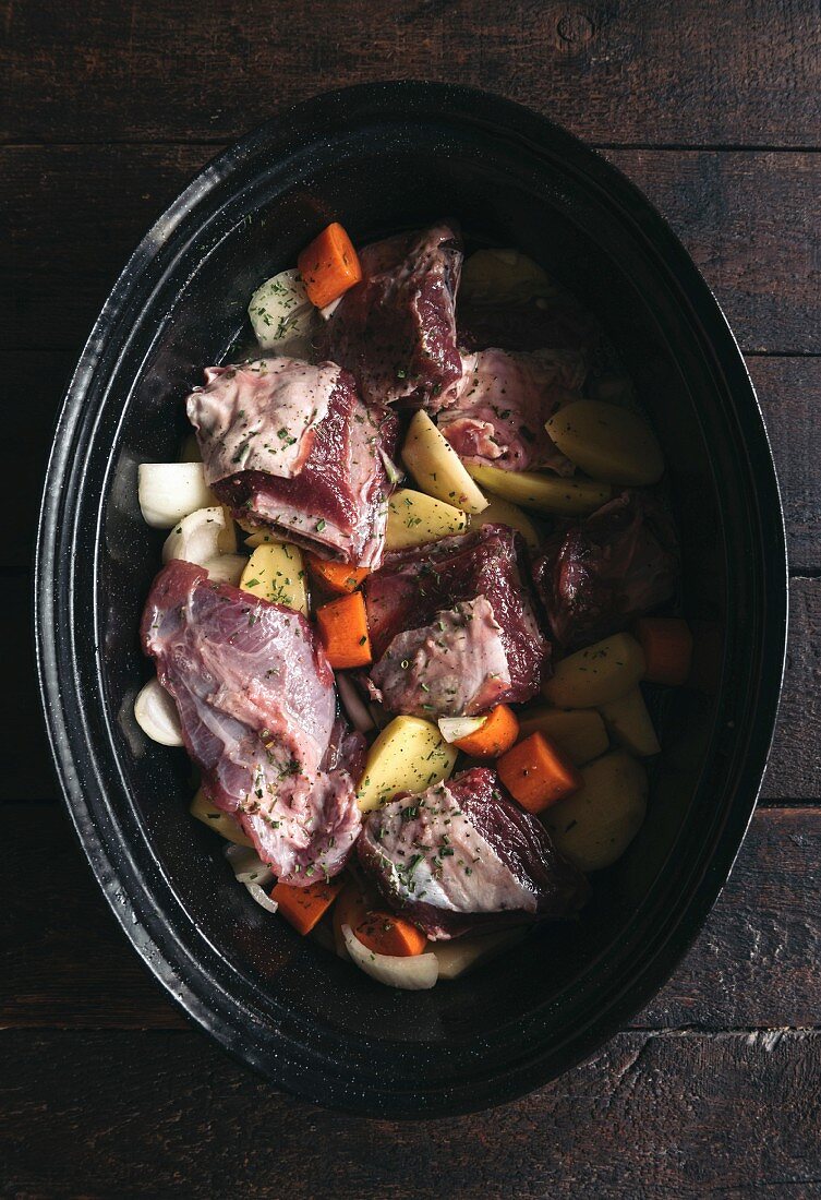 Preparing beef meat and potatoes in stew