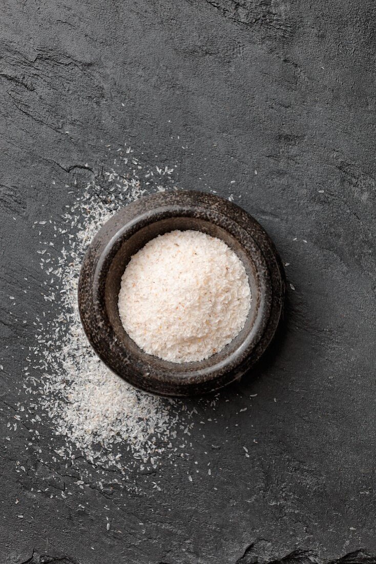 Psyllium seed husks in a stone mortar