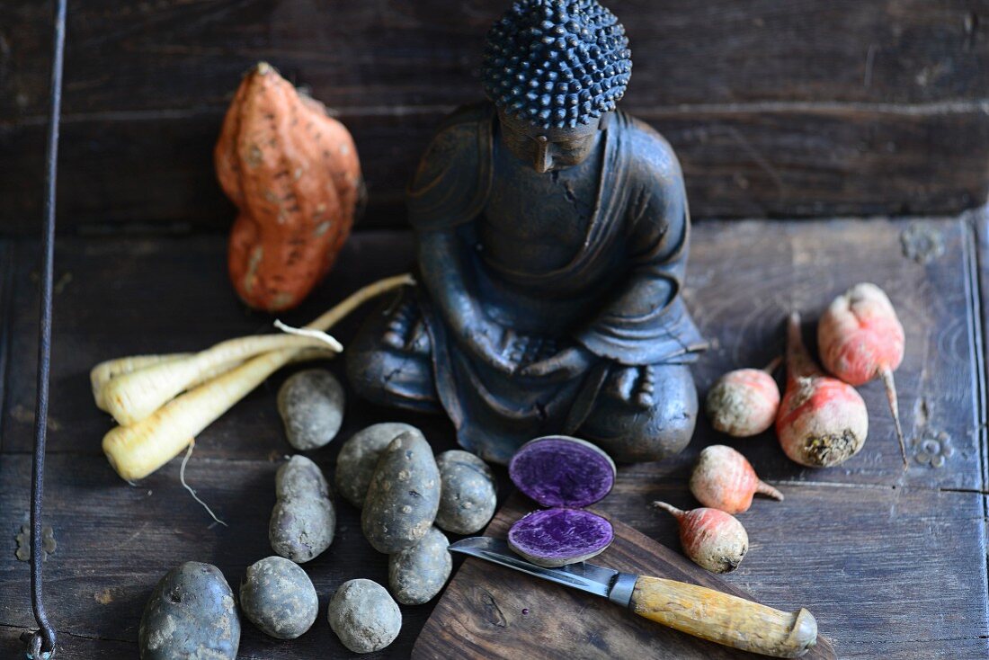 Colourful vegetables and a Buddha statue