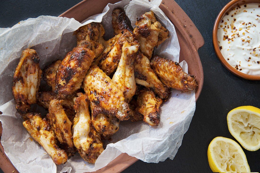 Baked chicken wings with lemon and a dip