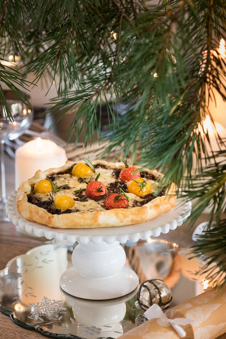 A porcini tart with mascarpone, cocktail tomatoes and rosemary