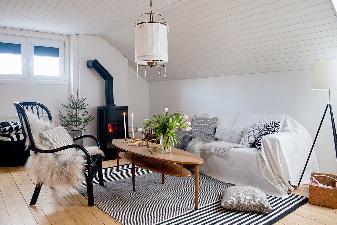 Attic living room with monochrome colour scheme
