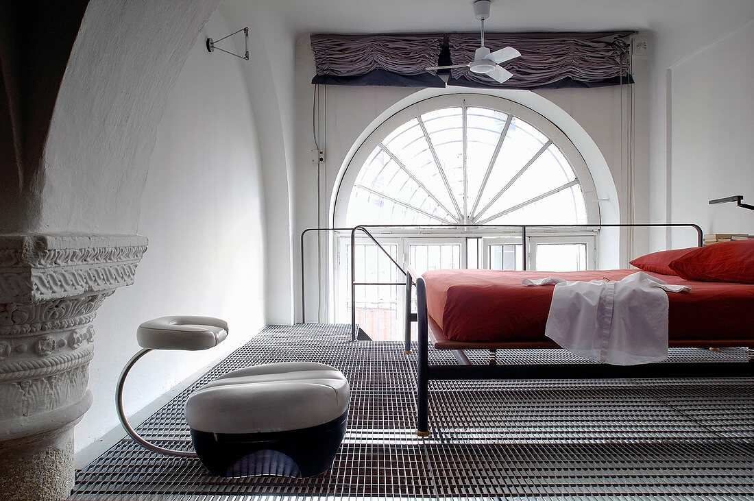 Bedroom on mezzanine with metal mesh floor