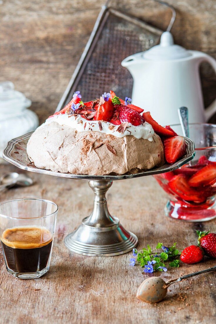 Chocolate pavlova with cream and strawberries