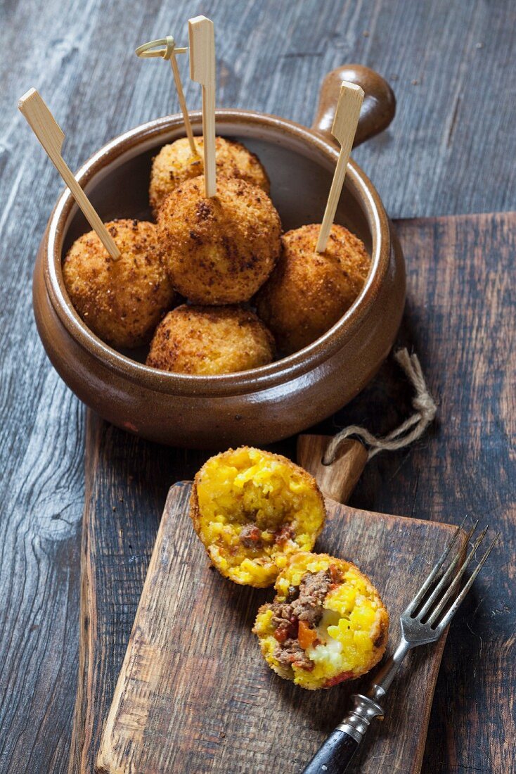 Arancini (fried rice balls filled with mince and mozzarella, Italy)