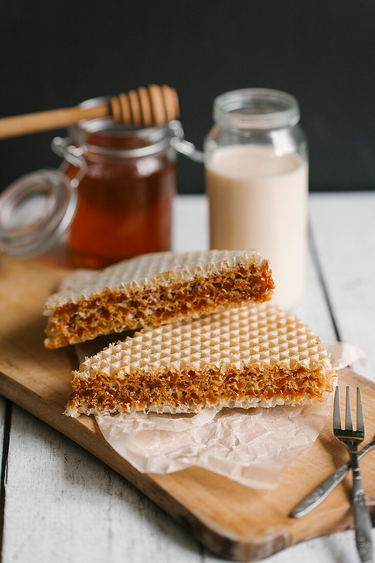 Honey wafer biscuits on a chopping board