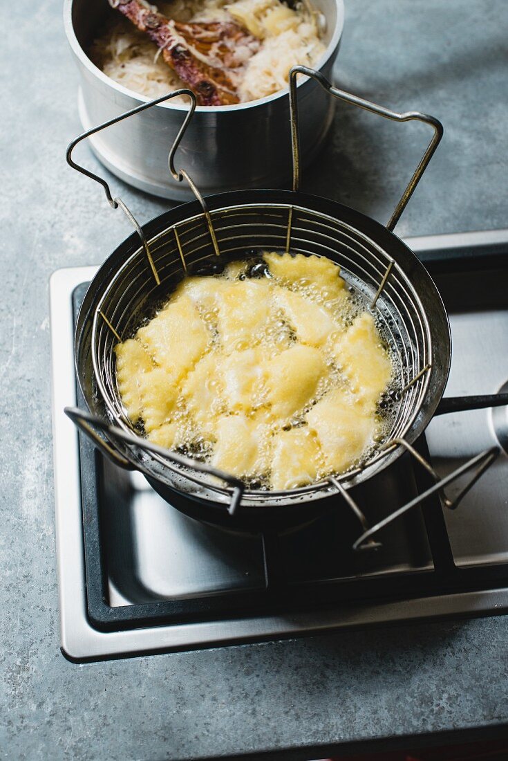 Potato leaves with sauerkraut in a fryer (South Tyrol)