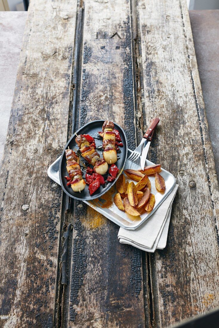 Shish kebabs with fried potato wedges