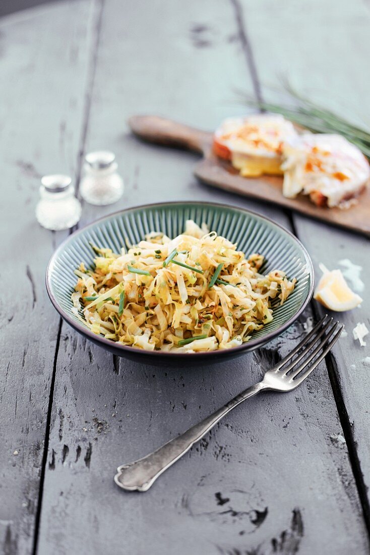 A pointed cabbage and lemon salad with fried cheese bread