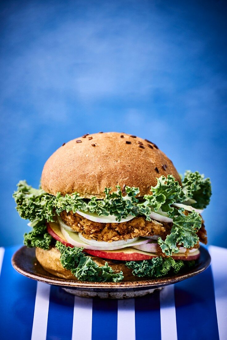 A burger with curly kale